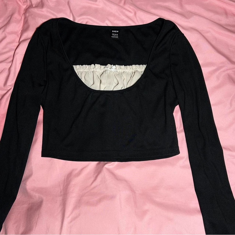 black long sleeve w white ruffles & white bow